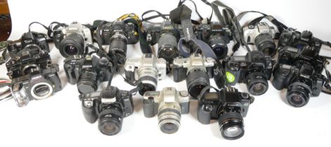 Thirty SLR vintage film cameras to include a Pentax P30, a canon EOS 1x7, a Minolta 505si, and a