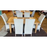 A modern solid light oak dining suite, comprising rectangular top table on square tapered legs, with