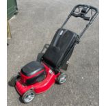 A Mountfield cordless battery operated lawn mower, model S42PDLi with charger.