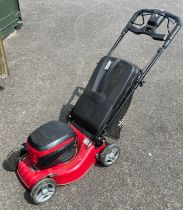 A Mountfield cordless battery operated lawn mower, model S42PDLi with charger.