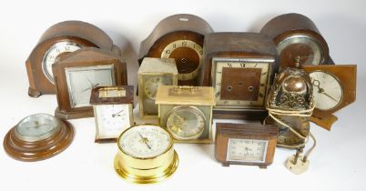 A collection of mid 20th century and later mantel clocks, alarm clocks and barometers in three