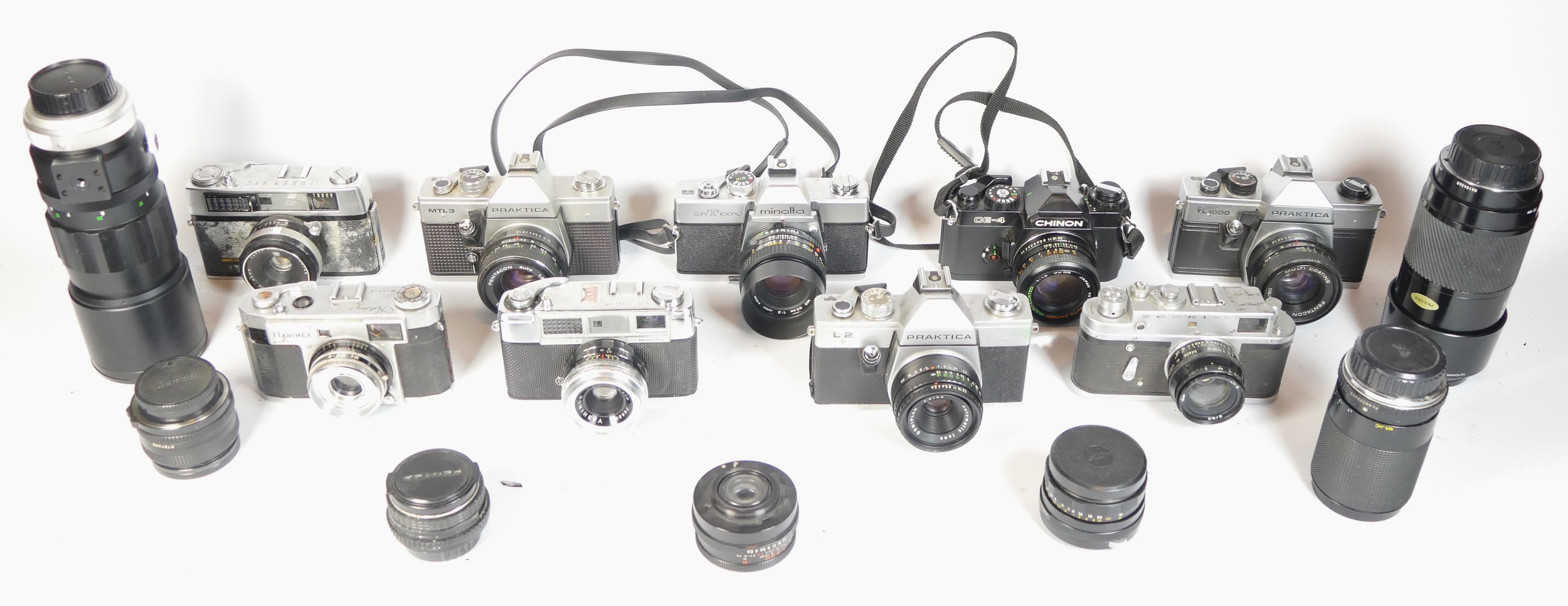 Nine SLR vintage film cameras to include a Chinon CE-4, a Praktica TL1000, a Hanimex Holiday II