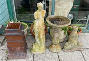 A collection of garden ornaments, to include a stoneware bird bath, a statue, a chimney pot and