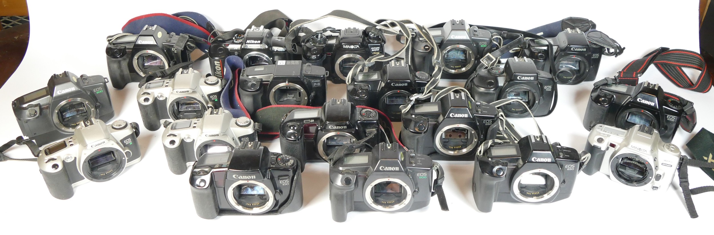 Twenty four SLR vintage film cameras to include a Canon EOS 500N, a Canon EOS 700, a Nikon F-401x