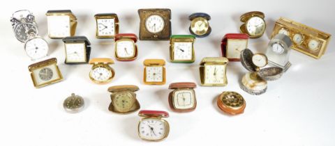 A collection of miniature novelty clocks, together with traveling alarm clocks, having quartz and