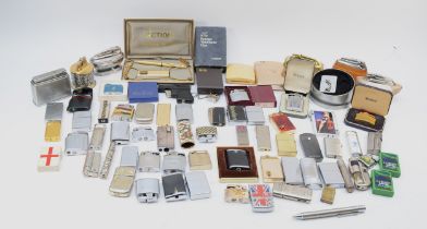 A collection of mid 20th century and later pocket and table cigarette lighters, petrol and gas