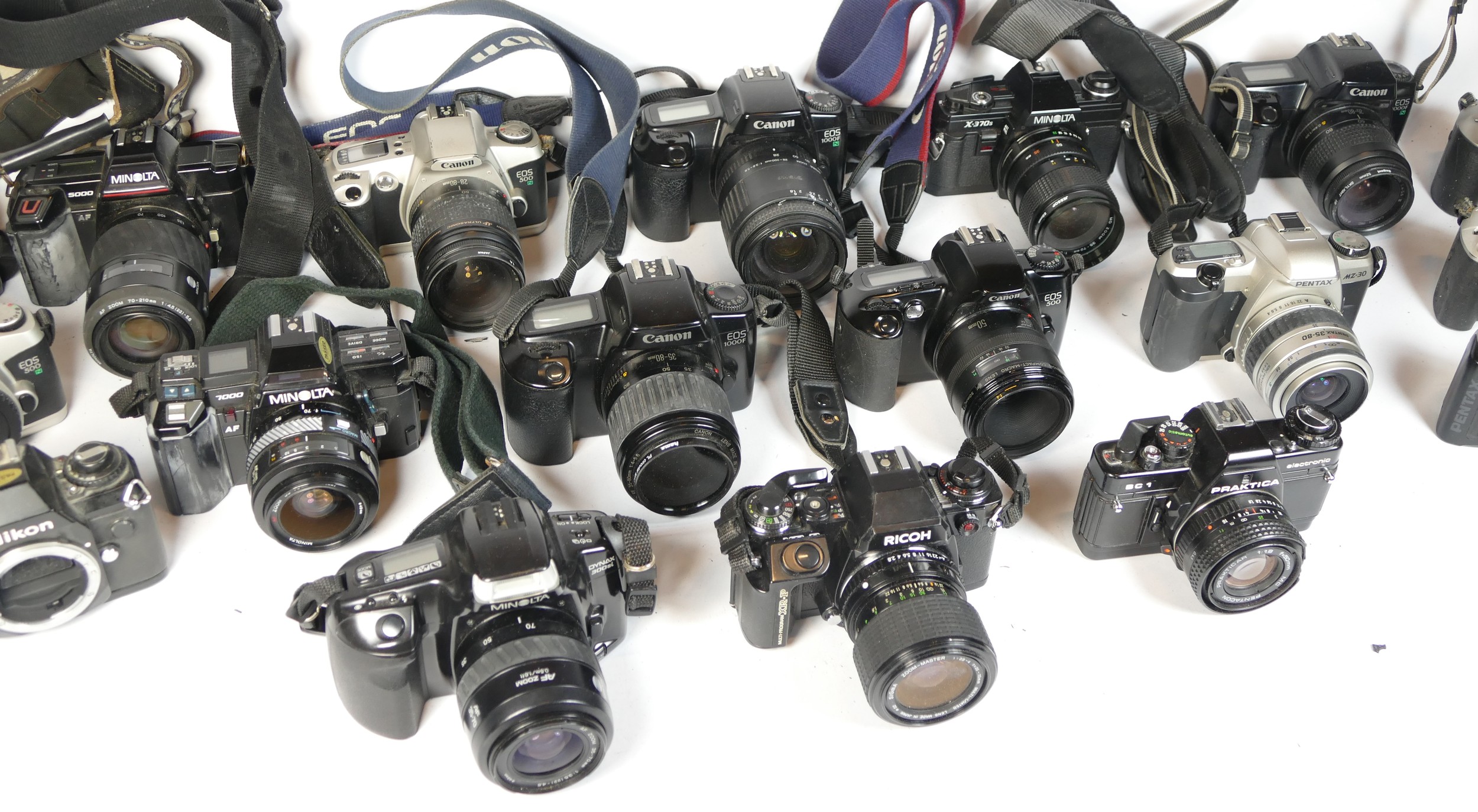 Twenty five SLR vintage film cameras to include a Canon EOS 1000f, a Minolta X-370s, a Pentax MZ- - Image 2 of 2