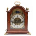 A modern Dutch mahogany case bracket clock, the arched brass dial with silvered chapter ring