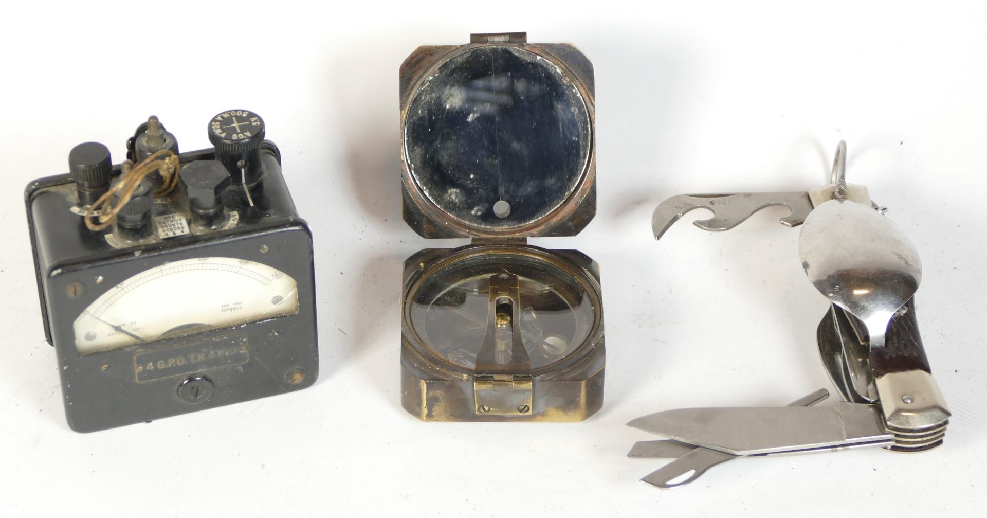 A Kelvin & Hughes 1917 brass compass, an electrical tester and a camping fork