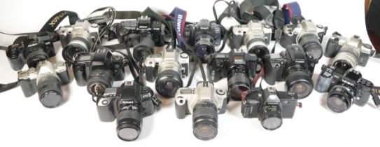 Twenty four SLR vintage film cameras to include a canon EOS 1000f, a Pentax MZ 50, a Canon EOS 500