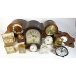 A collection of mid 20th century and later mantel clocks, alarm clocks and barometers in three