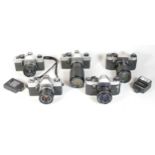 Five SLR vintage film cameras to include a Praktica Nova II, a Praktica Super TL and a Praktica PM3.