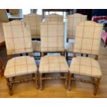A set of six light oak high backed dining chairs, having upholstered sprung seats and padded