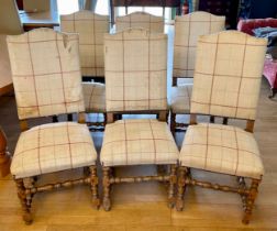 A set of six light oak high backed dining chairs, having upholstered sprung seats and padded