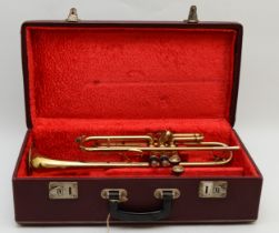 A cased trumpet stamped Zenith.