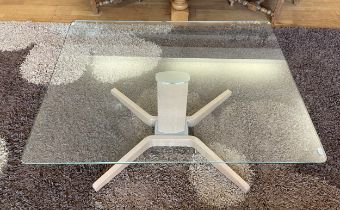 A modern glass topped occasional table of rectangular form, central column with spayed supports,