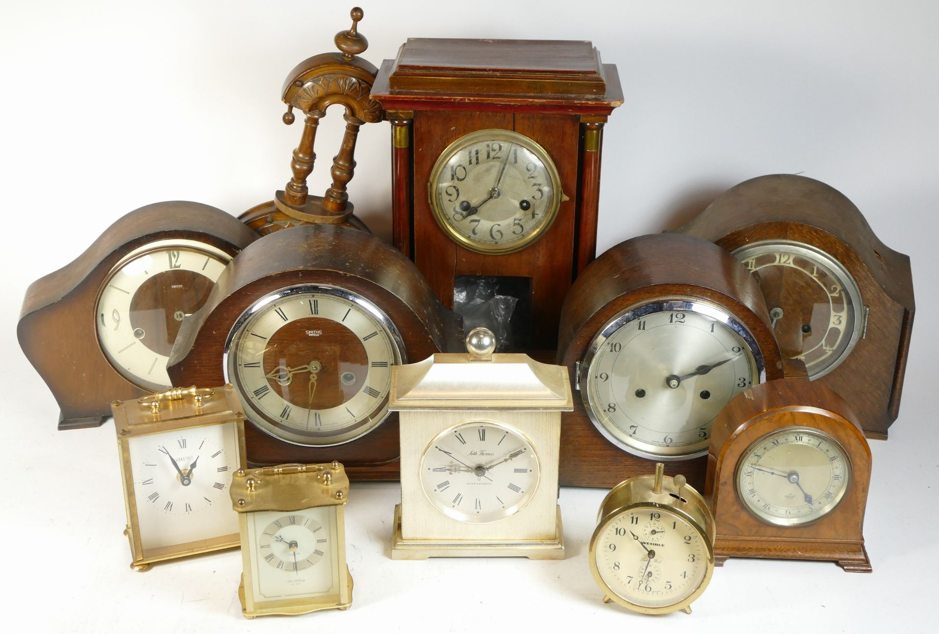 A collection of mid 20th century and later mantel clocks, alarm clocks and barometers, in three - Image 2 of 3