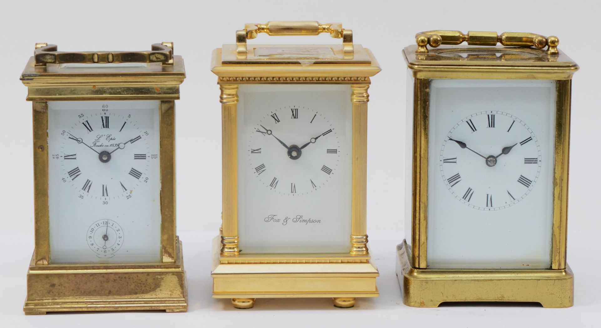 Three 20th century brass carriage clocks, having enamelled dials and 8 day movements. (3)