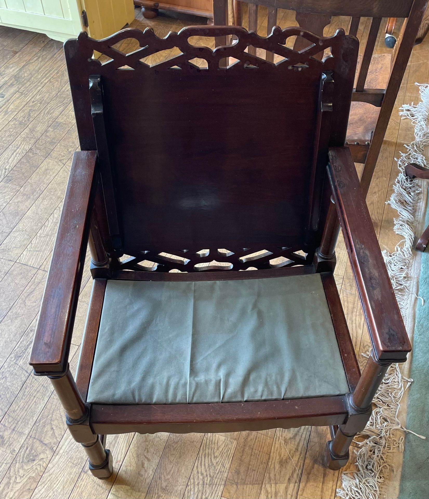 An oak fireside or chimney armchair, circa 1930s, with slatted back and bowed leather seat, the - Image 2 of 2