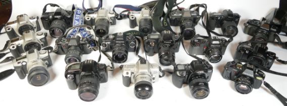 Twenty five SLR vintage film cameras to include a Praktica BX20, a Canon EOS 3000, a Pentax P30