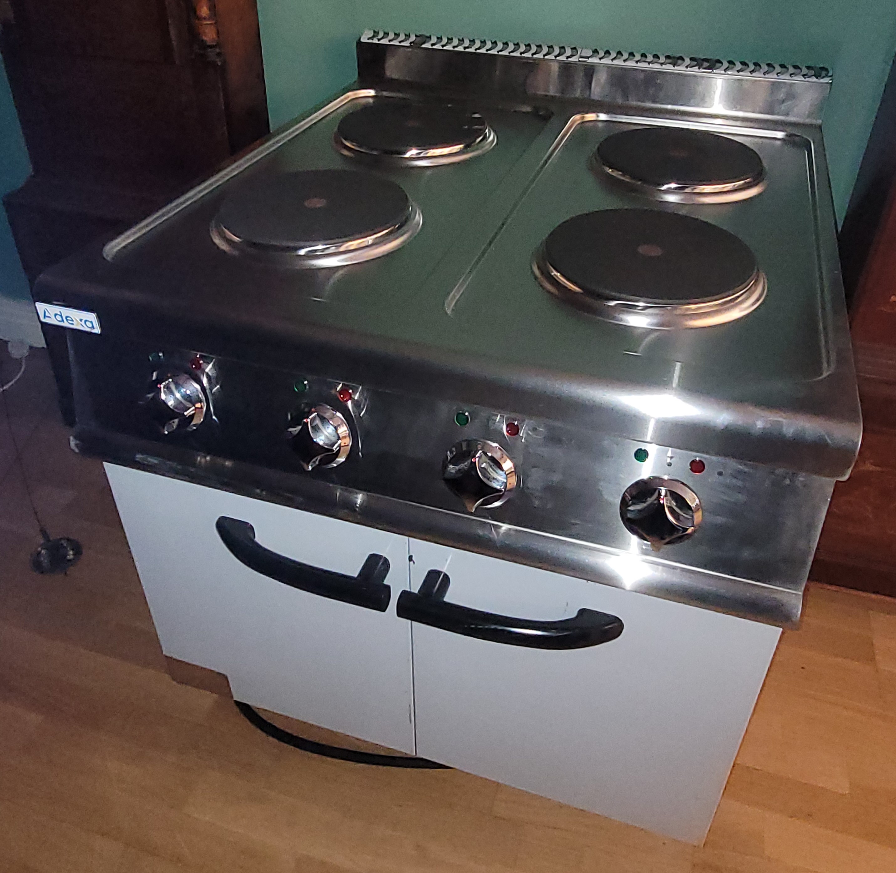 An Adexa industrial three phase electric four burner hob, stainless steel construction, having twin