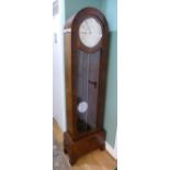 A mid 20th century Art Deco longcase clock, mahogany and walnut veneered case, the arched top with