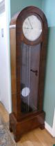 A mid 20th century Art Deco longcase clock, mahogany and walnut veneered case, the arched top with