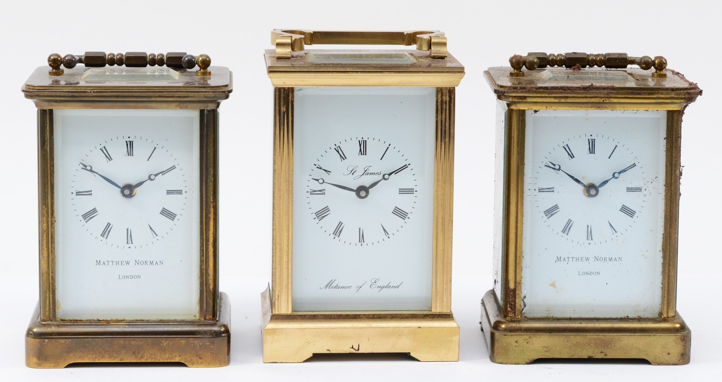 Three brass cased carriage clocks, circa late 20th century, having enamelled dials with Roman