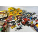 A collection of mid 20th century and later playworn diecast model vehicles, together with a quantity
