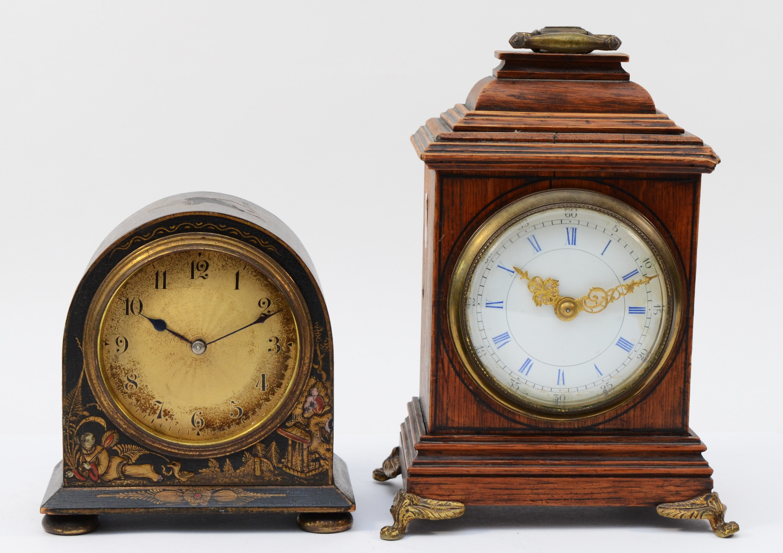 A 1930s mantel clock, having manual wind movement with gilt circular dial in black lacquered