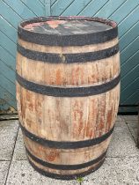 A large bound coopered oak barrel. H87, D55cm.