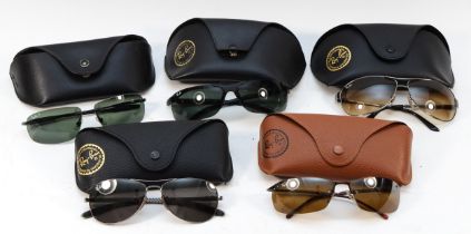 Five cased pairs of Ray Ban designer sunglasses.