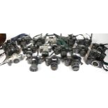 Twenty five SLR vintage film cameras to include a Canon EOS 100, a Canon EOS 500, a Minolta 7000 and