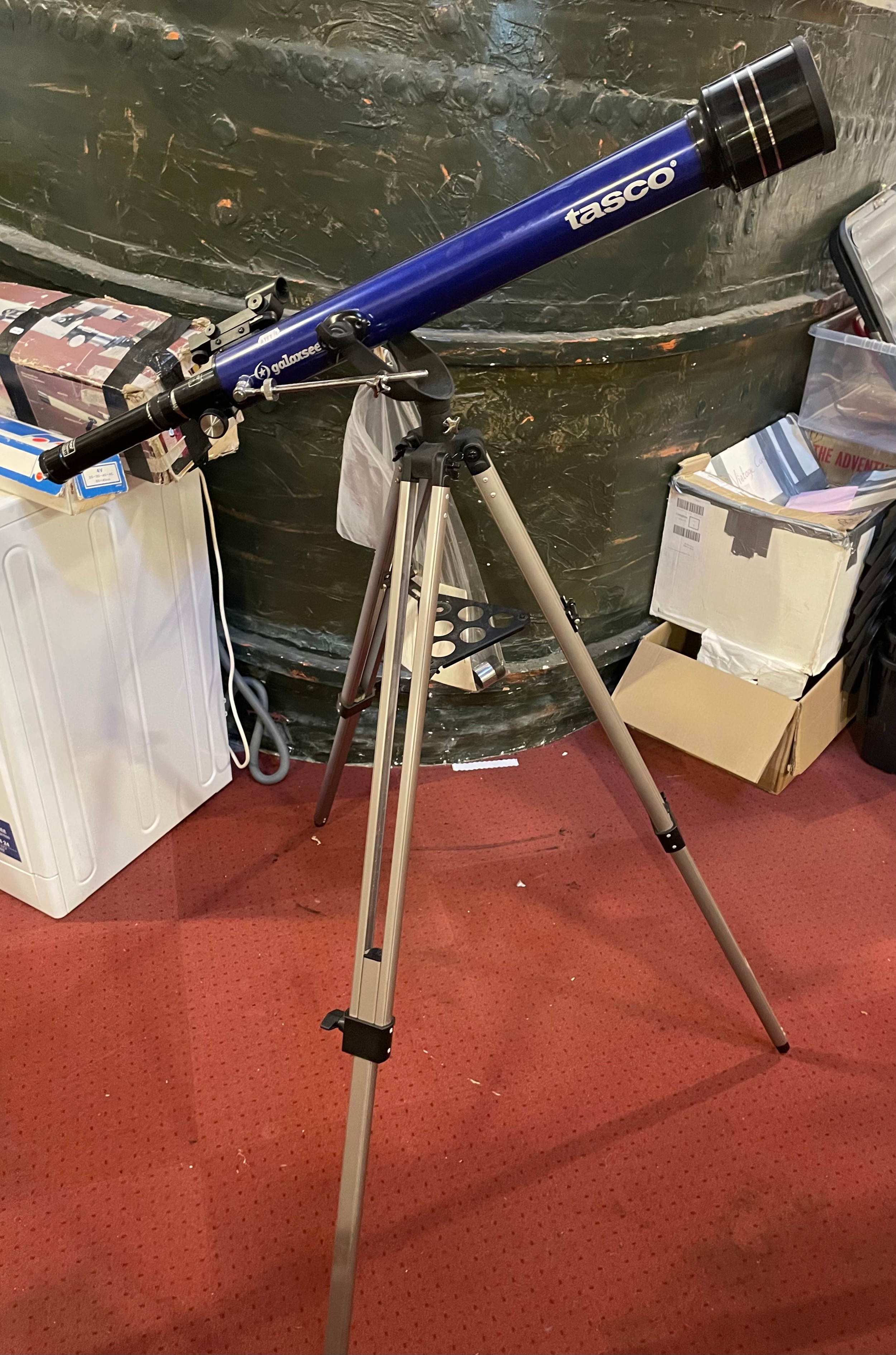 A modern Tasco 'Galaxsee' telescope on adjustable trypod, with accessories and instruction manual.