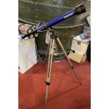 A modern Tasco 'Galaxsee' telescope on adjustable trypod, with accessories and instruction manual.