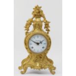 A 20th century Italian gilt metal Rococo style mantel clock, the bombe shaped leaf swept case