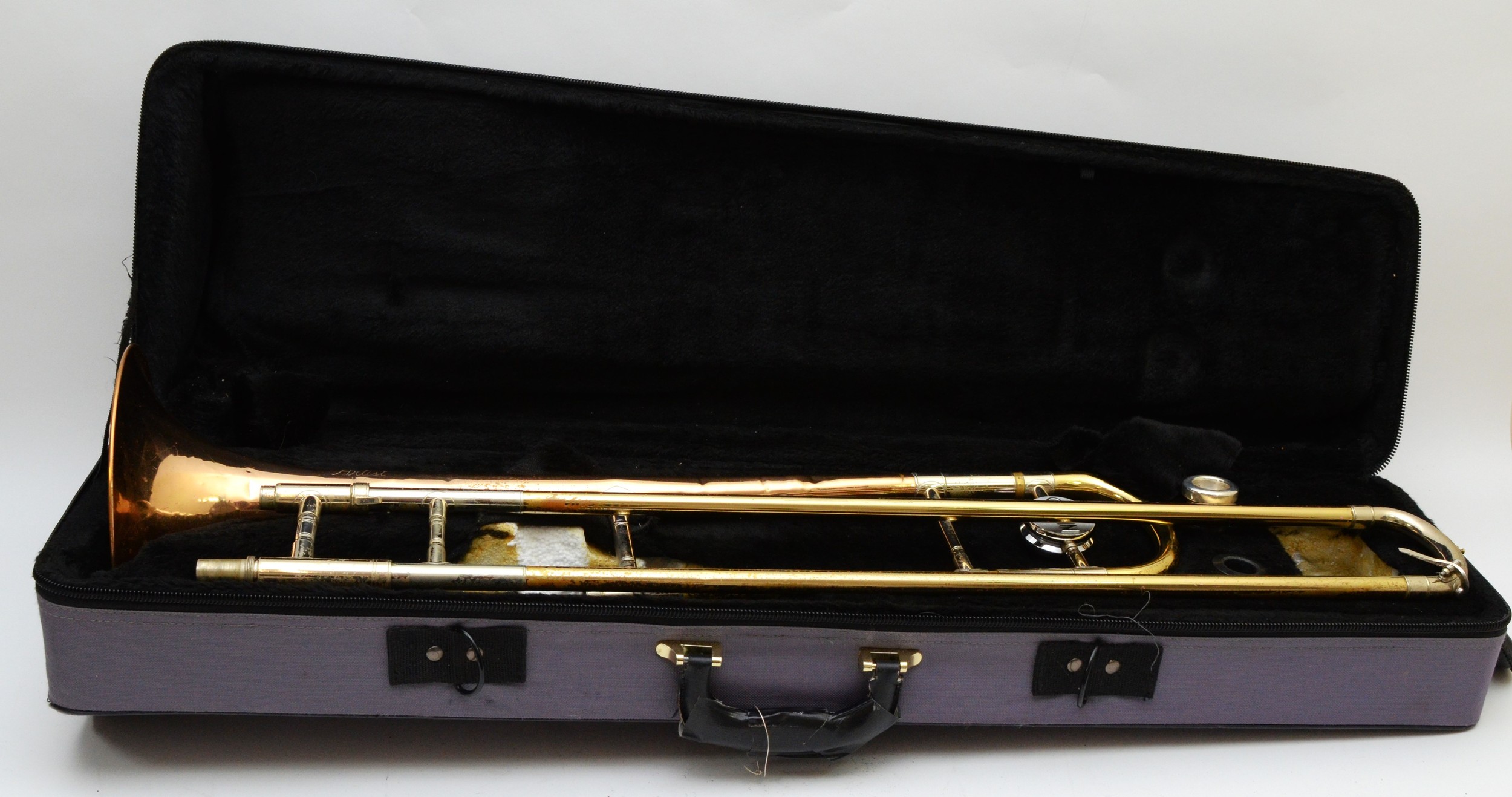 A cased trombone 'Artist' stamped C.G Conn Ltd U.S.A. - Image 2 of 3