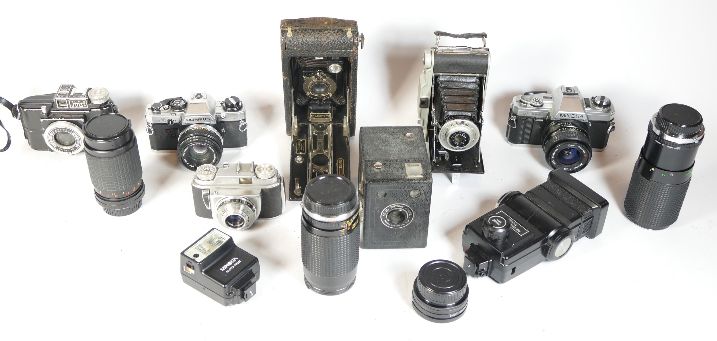 Eight mixed cameras to include a Ferrania, a SIX-20 Brownie Junior with flash holder, an Olympus