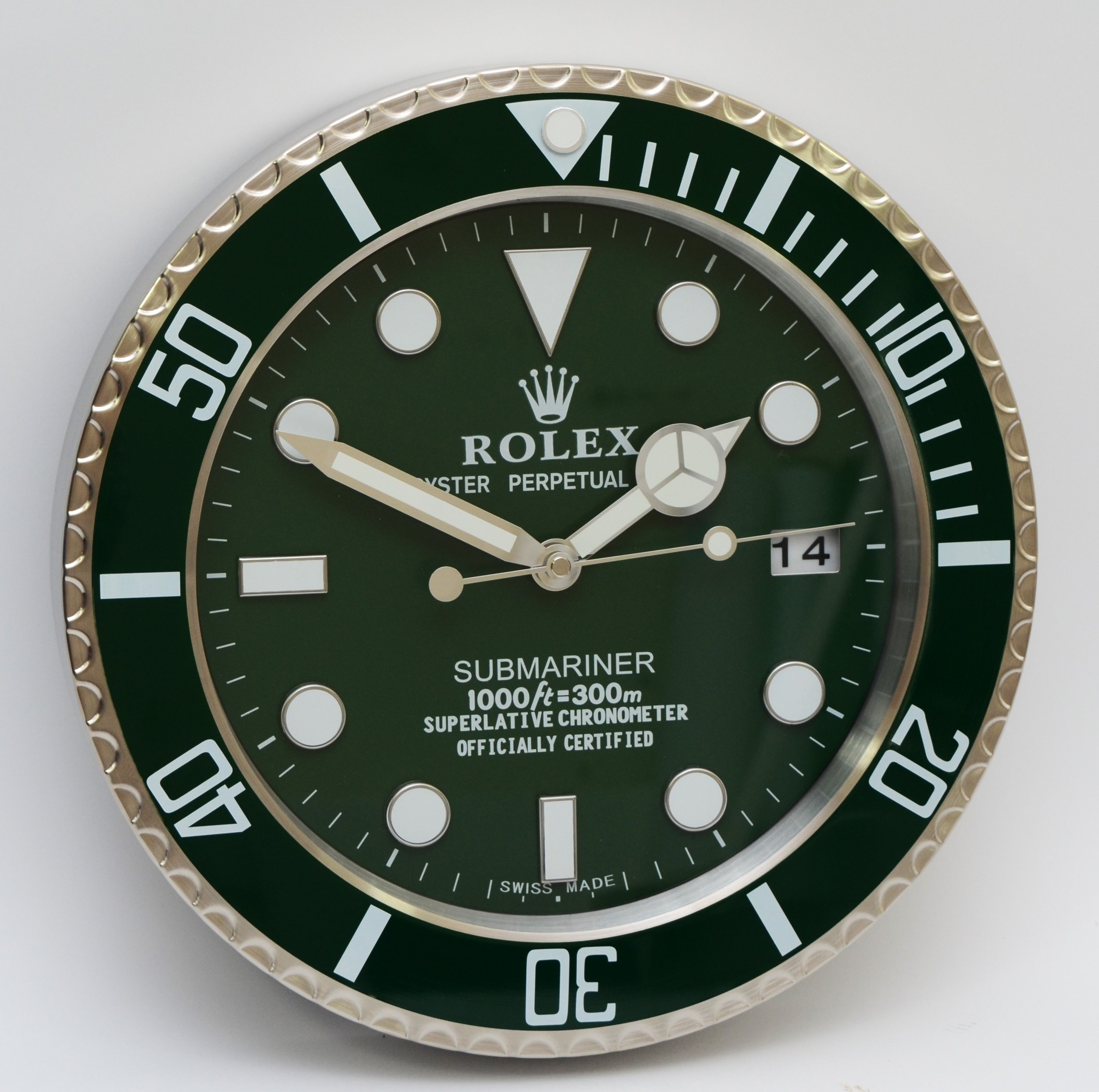 A 'Rolex' style advertising wall clock, green dial reads 'Rolex Oyster Perpetual Submariner'