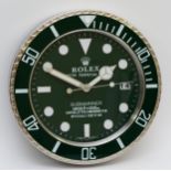 A 'Rolex' style advertising wall clock, green dial reads 'Rolex Oyster Perpetual Submariner'