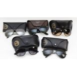 Five cased pairs of Ray-Ban sunglasses, two bearing model numbers - RB4118, RB4165, and one
