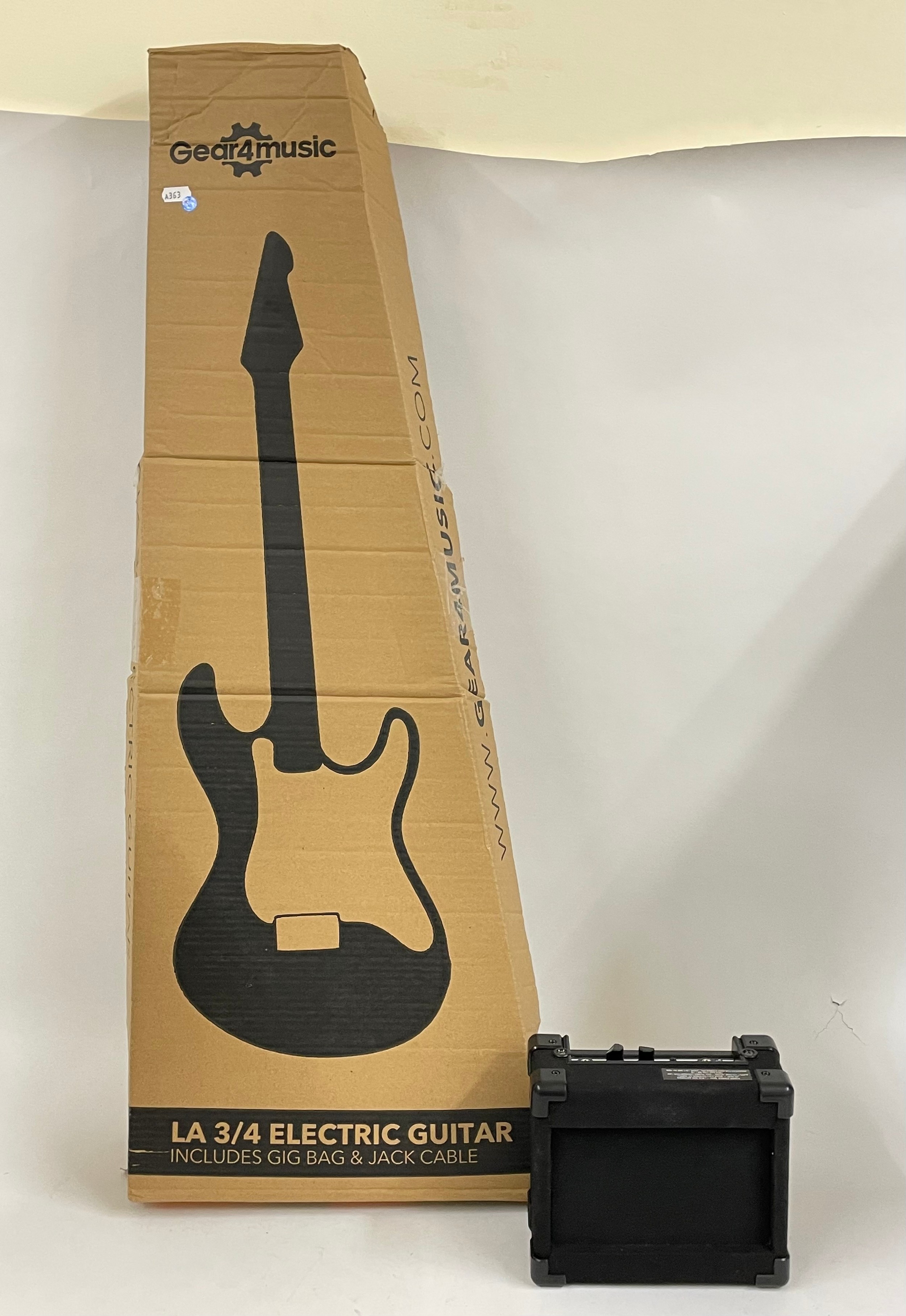 A modern 'Gear4Music ' electric guitar, to include gig bag, jack cable, amp, tuner, original box