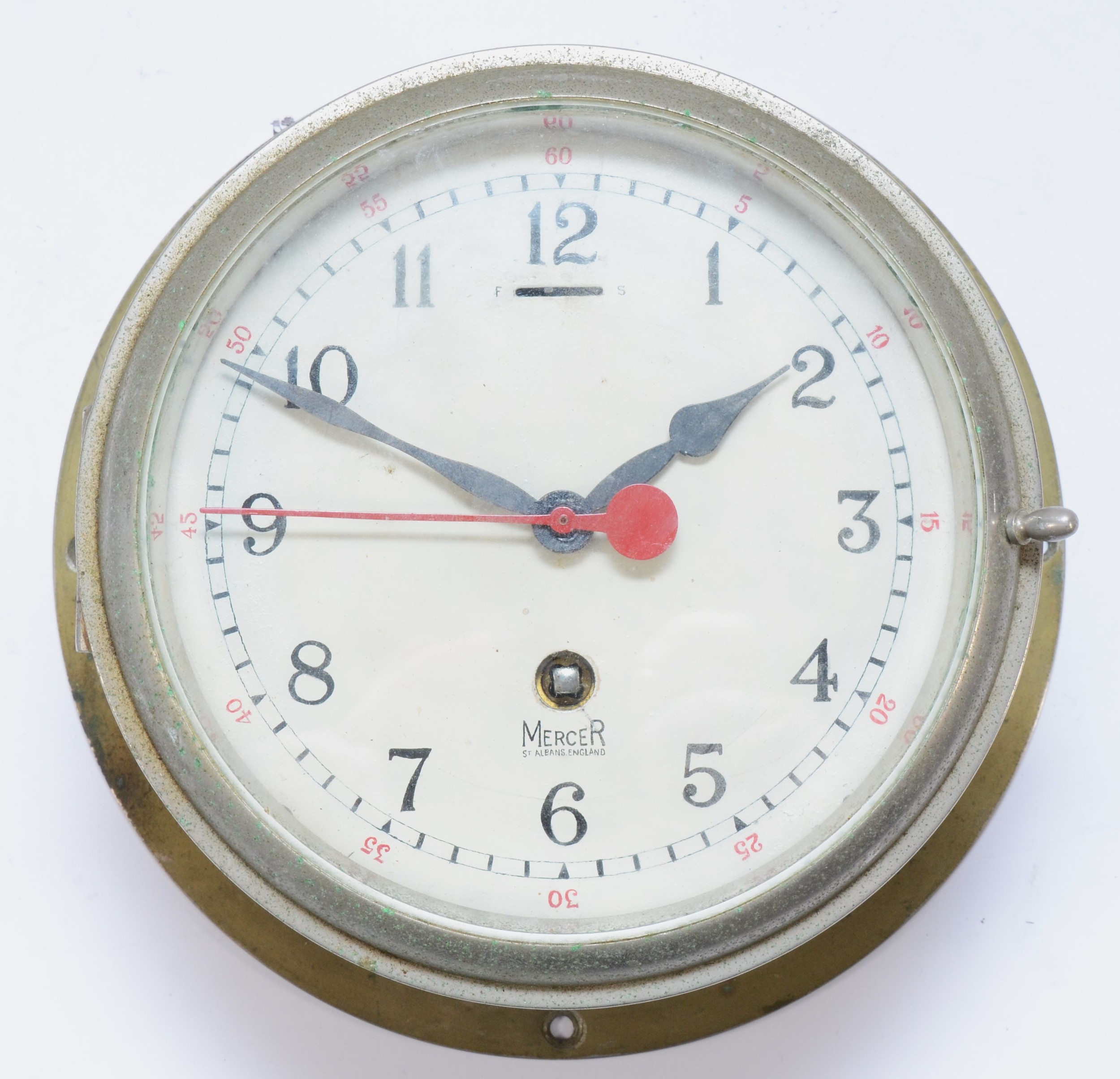 A 20th century ships bulkhead clock, the brass and nickel plated case with painted dial inscribed
