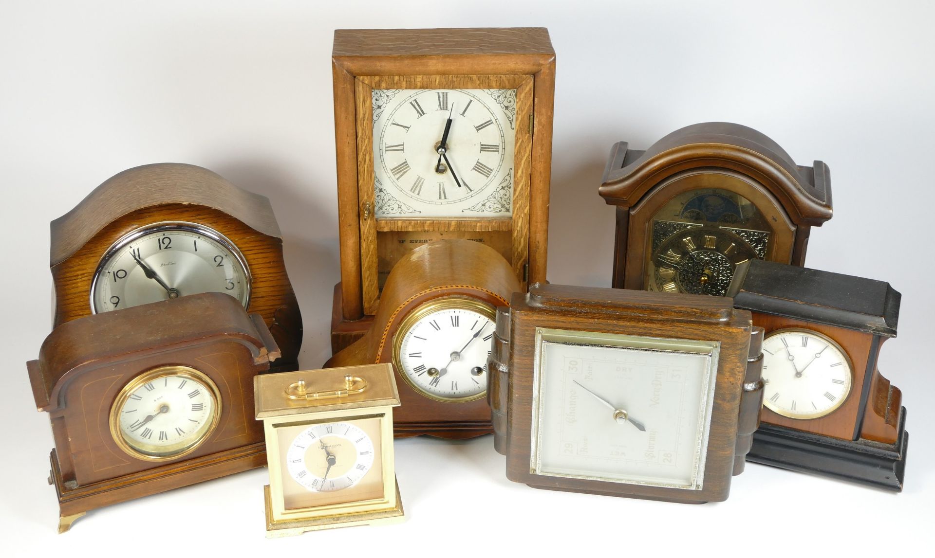 A collection of mid 20th century and later mantel clocks, alarm clocks and barometers in three - Image 2 of 3