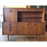 Stonehill Furniture: A mid 20th century teak sideboard/drinks cabinet. W152, H121, D45cm.