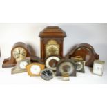 A collection of mid 20th century and later mantel clocks, alarm clocks and barometers in three