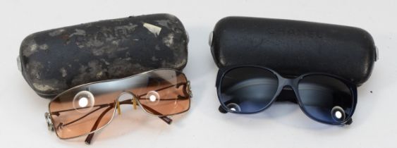 Two cased pairs of ladies vintage Chanel sunglasses.