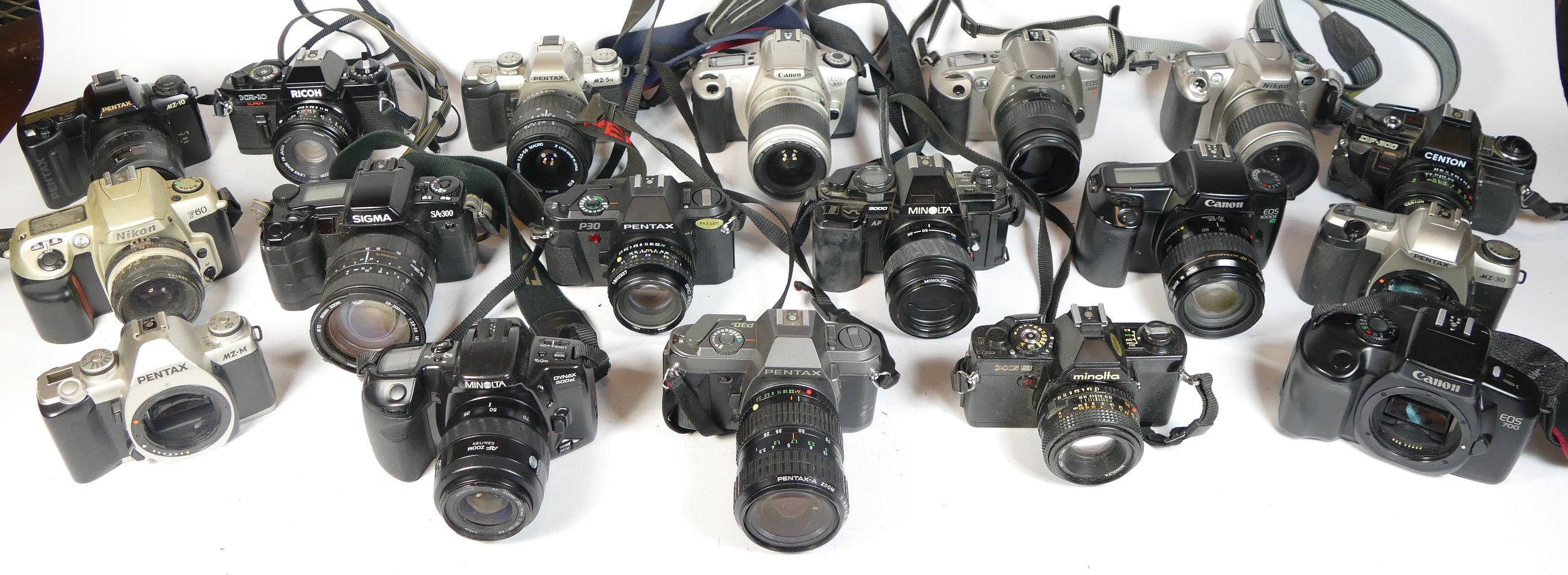 Twenty four SLR vintage film cameras to include a Pentax MZ-M, a Minolta 300si, a Carena 100sx and a