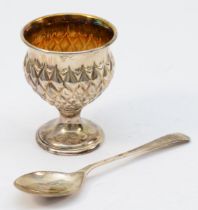 A silver christening egg cup and spoon set, by Mappin & Webb, Birmingham 1986, of thistle form,