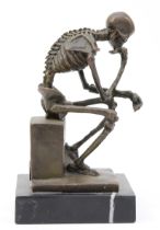 A bronze figural model of a seated skeleton, signed 'Milo' later casting, with foundry stamp, upon